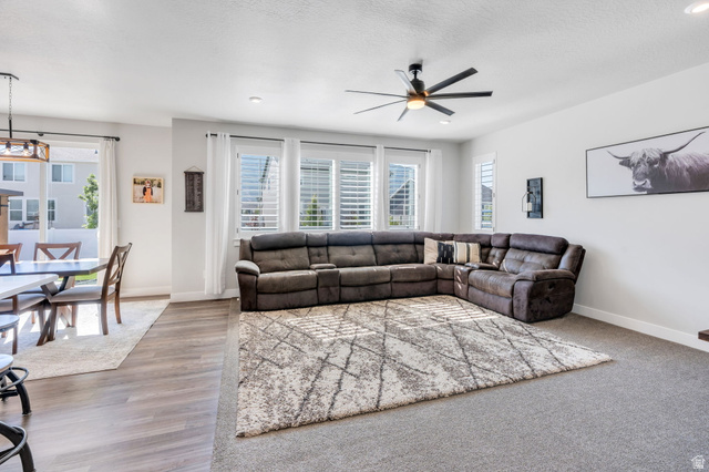 252 North Sunrise Rnch Drive Mapleton, UT 84664 - Photo 15 of 62 Spacious living area featuring a contemporary ceiling fan with integrated lighting, recessed lighting, and multiple windows with plantation shutters