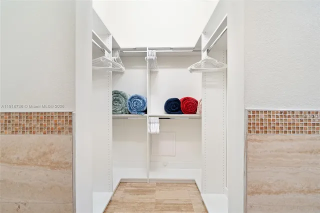 a bathroom with a double vanity sink and mirror
