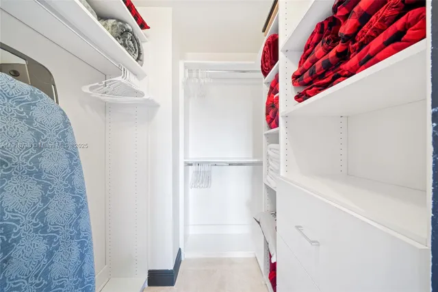 a bathroom with a glass shower door and a bathtub