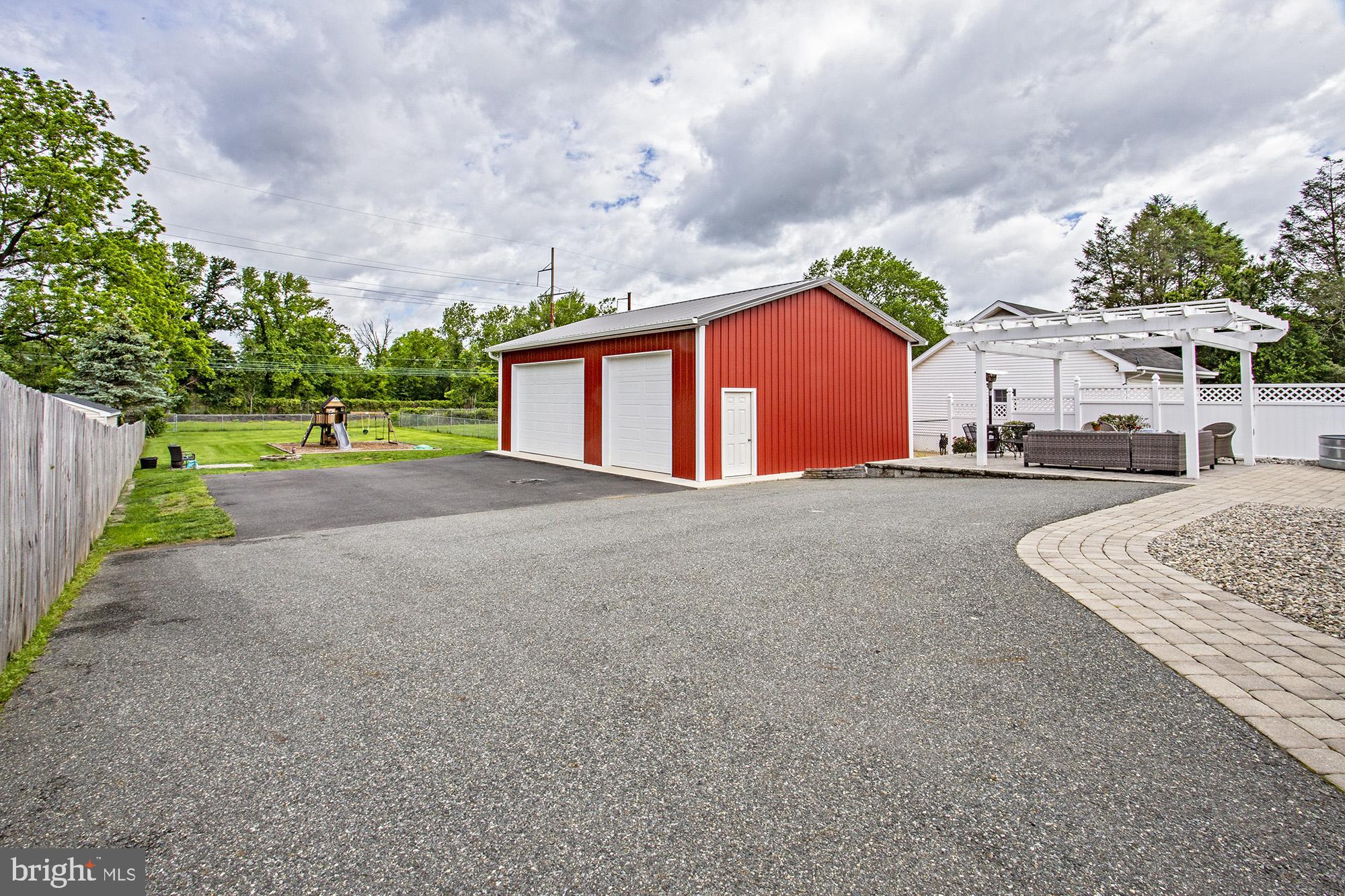 5000 Ogletown Stanton Road Newark, DE 19713 - Photo 2 of 39 a front view of a house with a yard and garage