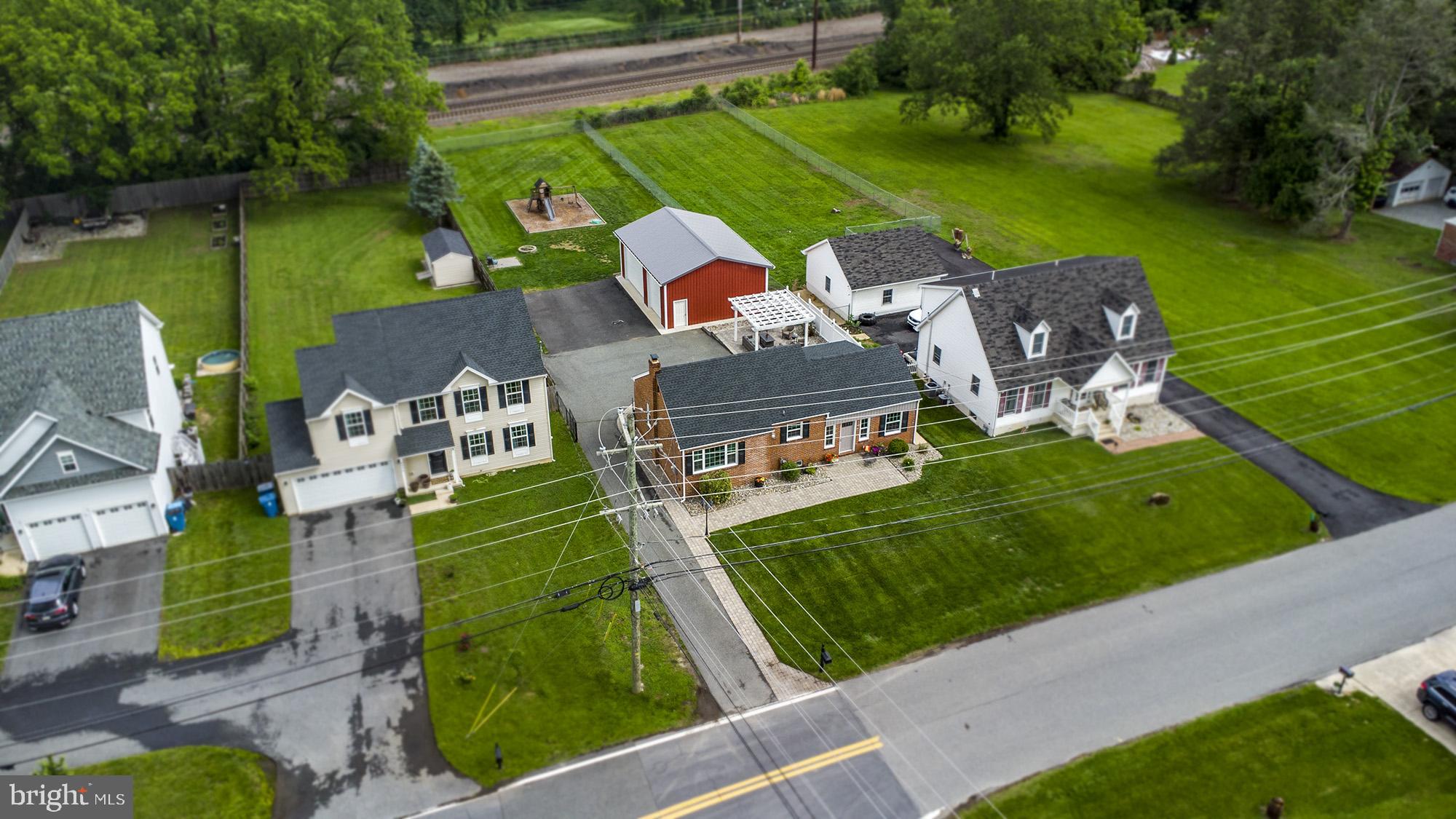 5000 Ogletown Stanton Road Newark, DE 19713 - Photo 30 of 39 an aerial view of a house with a garden and lake view