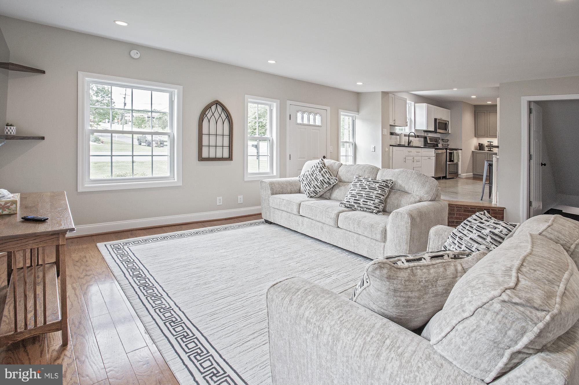 5000 Ogletown Stanton Road Newark, DE 19713 - Photo 5 of 39 a living room with furniture window and a wooden floor