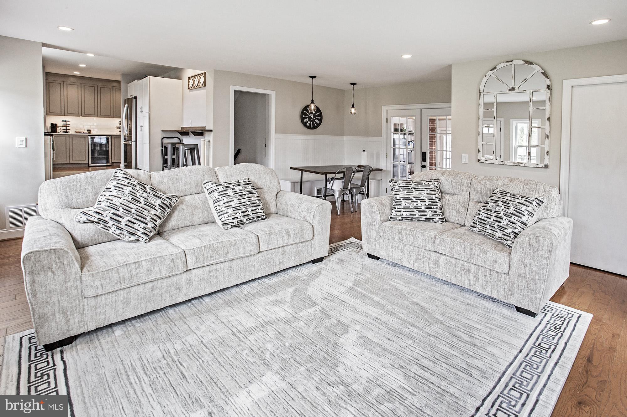 5000 Ogletown Stanton Road Newark, DE 19713 - Photo 6 of 39 a living room with furniture and a wooden floor