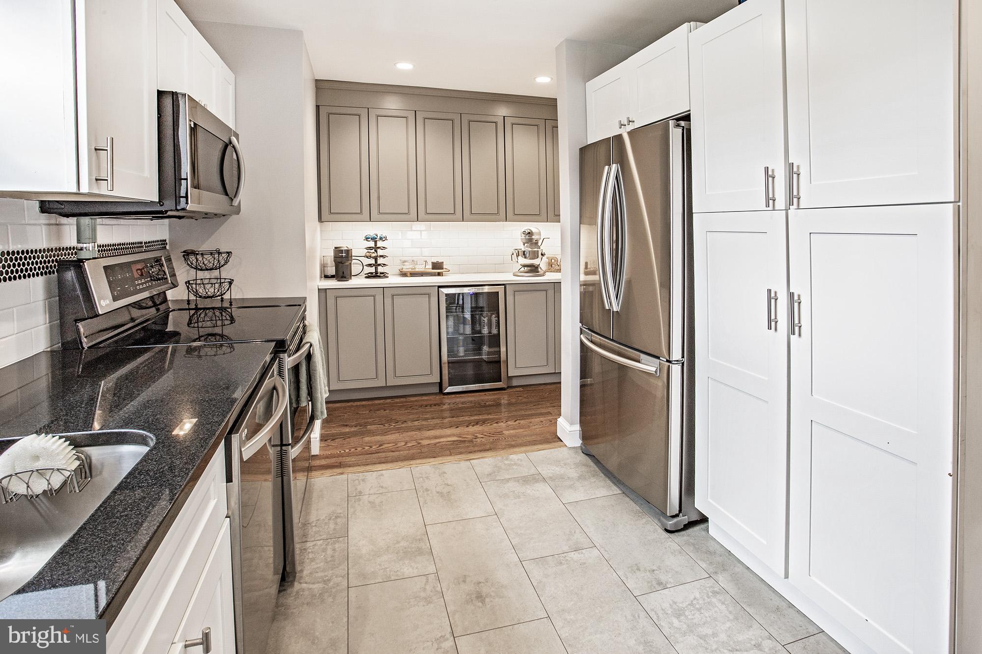 5000 Ogletown Stanton Road Newark, DE 19713 - Photo 8 of 39 a kitchen with a refrigerator sink and stove