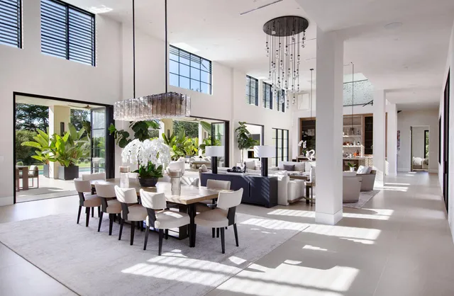 a view of a dining room with furniture and chandelier