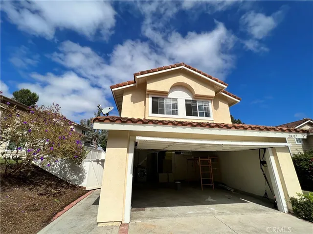 a view of a house with a sink and yard
