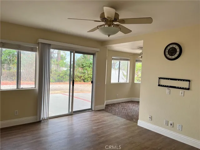 a view of a kitchen with a sink dishwasher and wooden floor