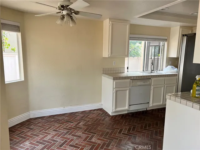 a kitchen with a sink stove and microwave