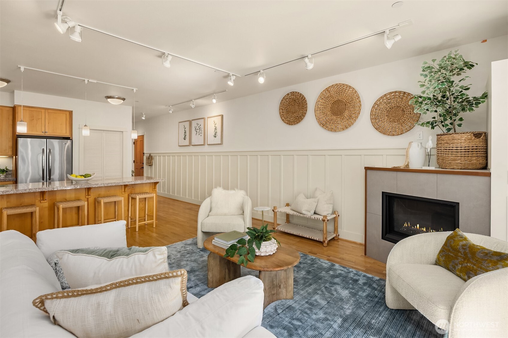 144 Hall Brothers Loop Northwest, Unit 101 Bainbridge Island, WA 98110 - Photo 11 of 30 a living room with furniture and a fireplace