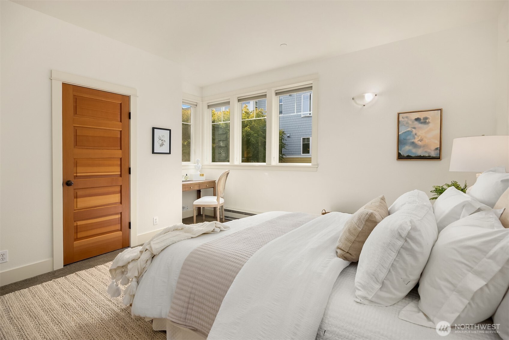 144 Hall Brothers Loop Northwest, Unit 101 Bainbridge Island, WA 98110 - Photo 17 of 30 a bedroom with a bed and a window