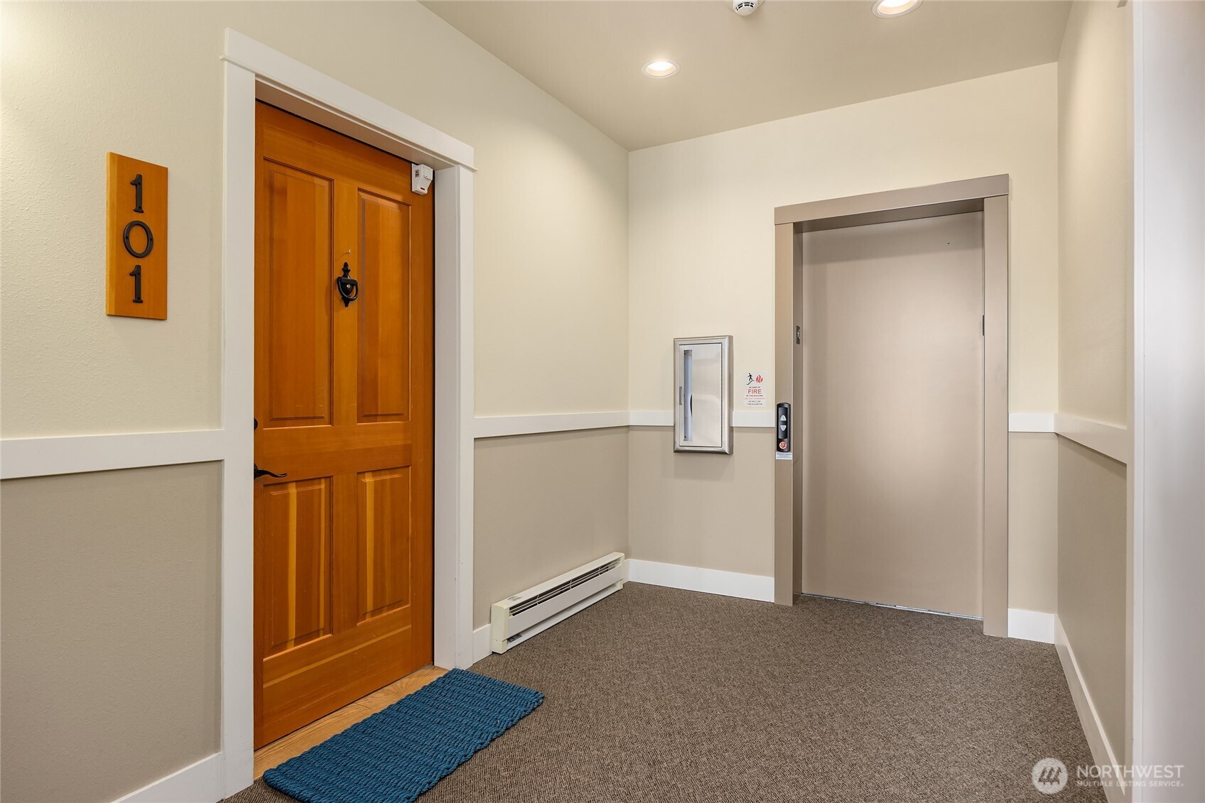144 Hall Brothers Loop Northwest, Unit 101 Bainbridge Island, WA 98110 - Photo 24 of 28 an empty room with wooden floor and closet