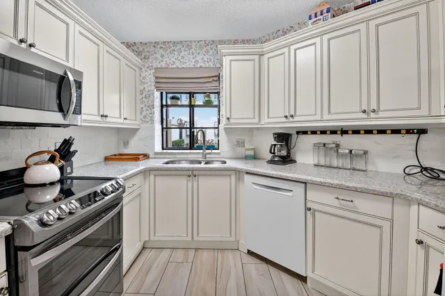 a bedroom with a bed couch and window