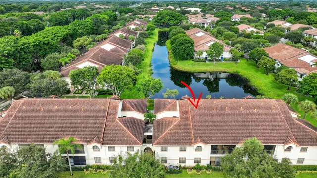 an aerial view of house with swimming pool outdoor seating and yard