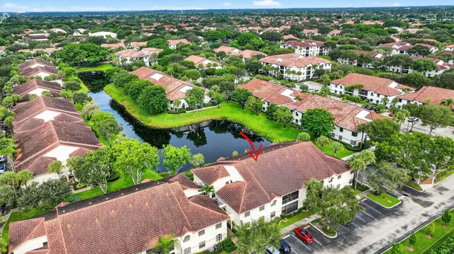a view of a two chairs in the backyard