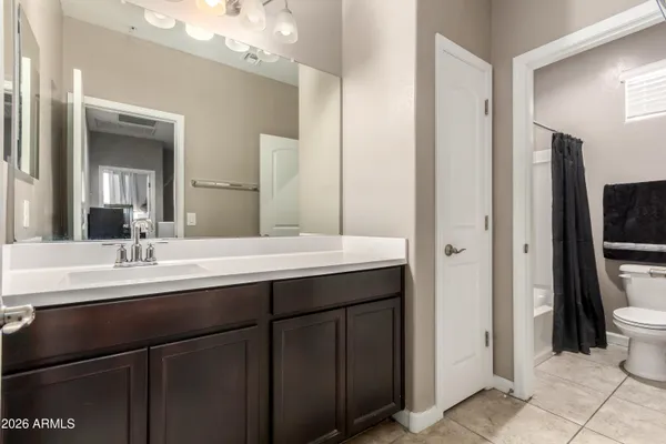 a bathroom with 2 sink and a mirror