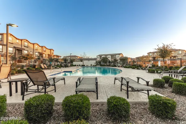 a view of a lake with outdoor seating space