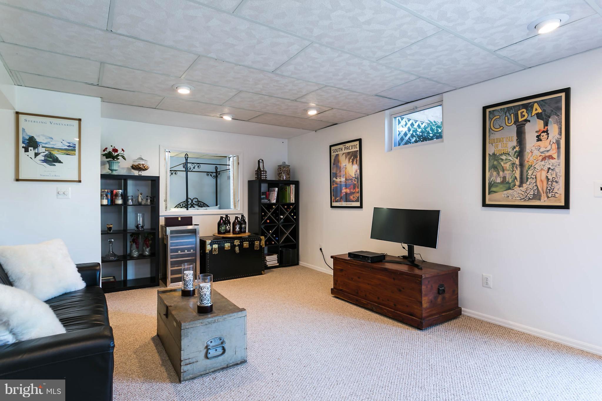 5106 Beaverbrook Road Columbia, MD 21044 - Photo 24 of 30 a living room with furniture and a flat screen tv