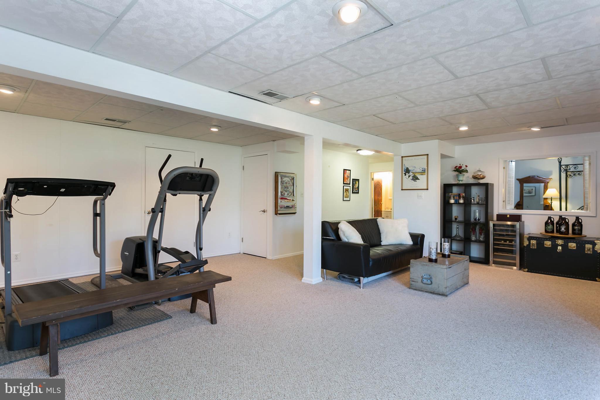 5106 Beaverbrook Road Columbia, MD 21044 - Photo 26 of 30 a living room with furniture gym equipment and a table