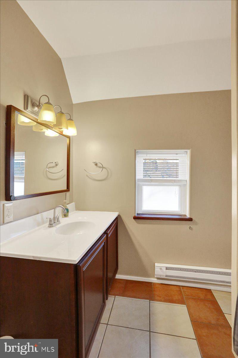321 Pershing Boulevard Reading, PA 19607 - Photo 19 of 36 a bathroom with a sink and a mirror