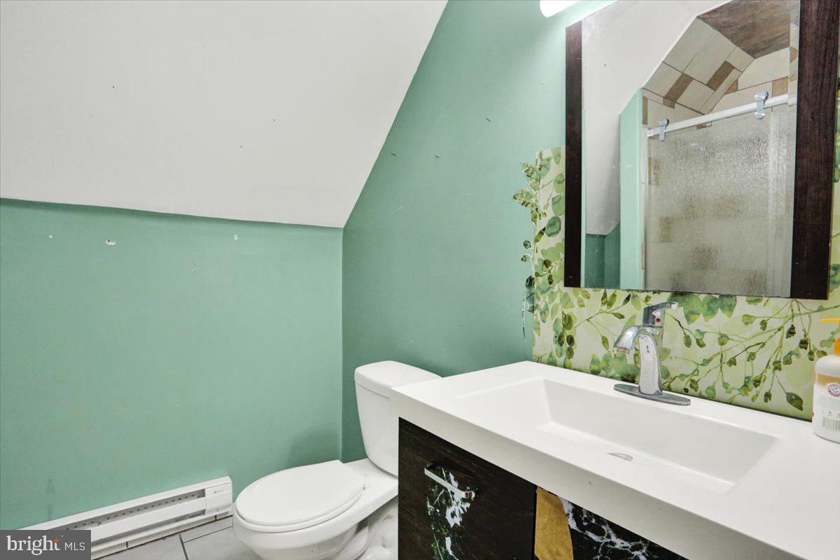 321 Pershing Boulevard Reading, PA 19607 - Photo 24 of 36 a bathroom with a sink a toilet and shower