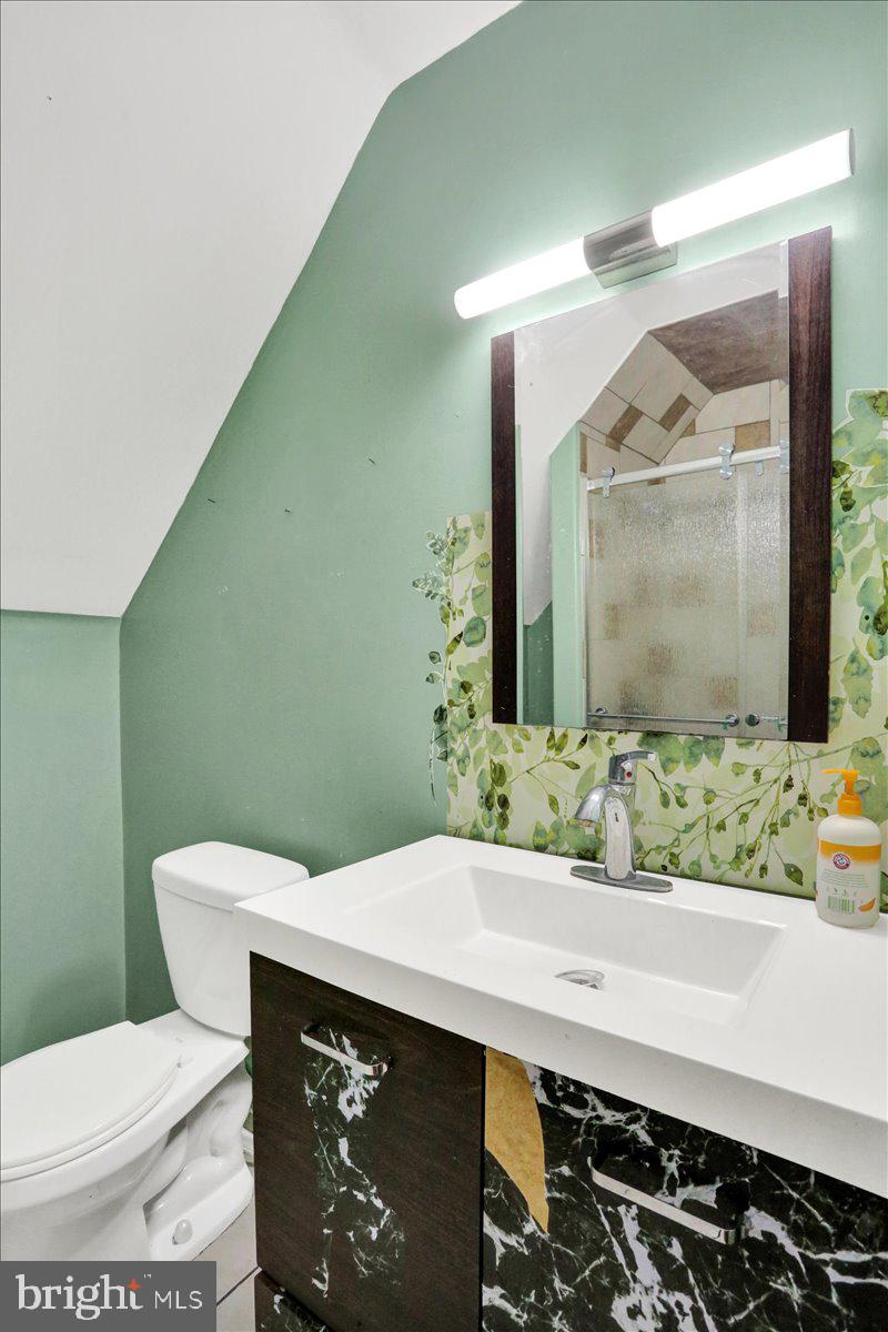 321 Pershing Boulevard Reading, PA 19607 - Photo 25 of 36 a bathroom with a sink and mirror