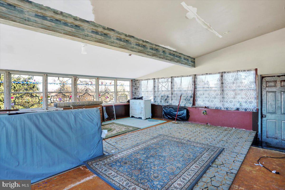321 Pershing Boulevard Reading, PA 19607 - Photo 26 of 36 a large room with lots of furniture and wooden floor