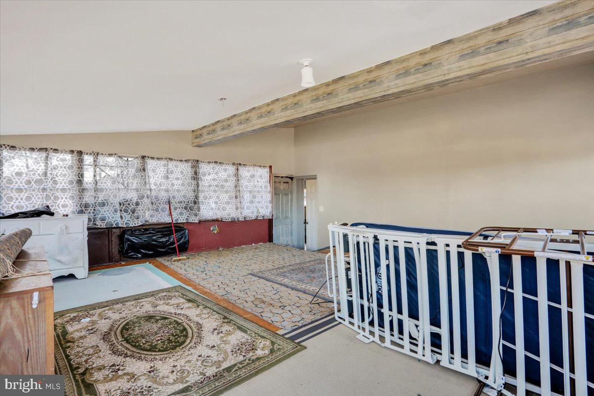 321 Pershing Boulevard Reading, PA 19607 - Photo 28 of 36 a living room with furniture stove and a table