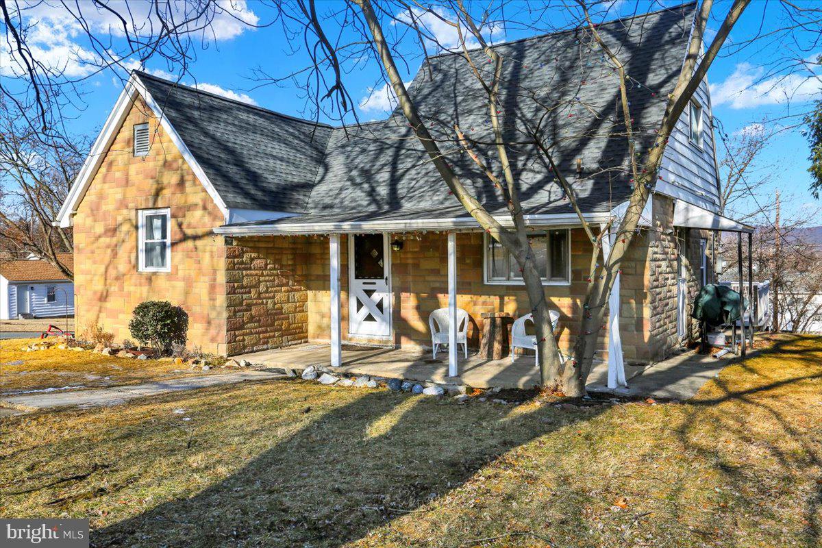 321 Pershing Boulevard Reading, PA 19607 - Photo 3 of 36 a view of a house with snow on the wall