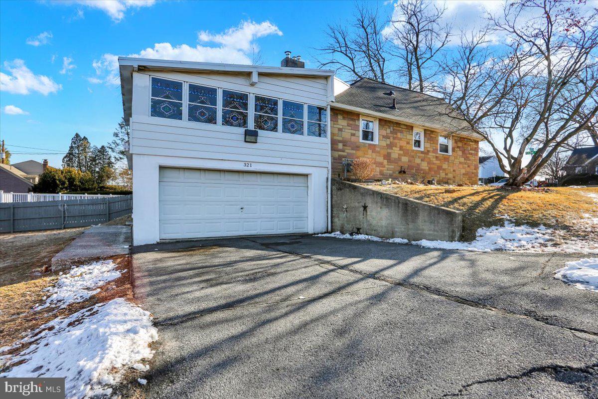 321 Pershing Boulevard Reading, PA 19607 - Photo 4 of 36 a front view of a house with a yard