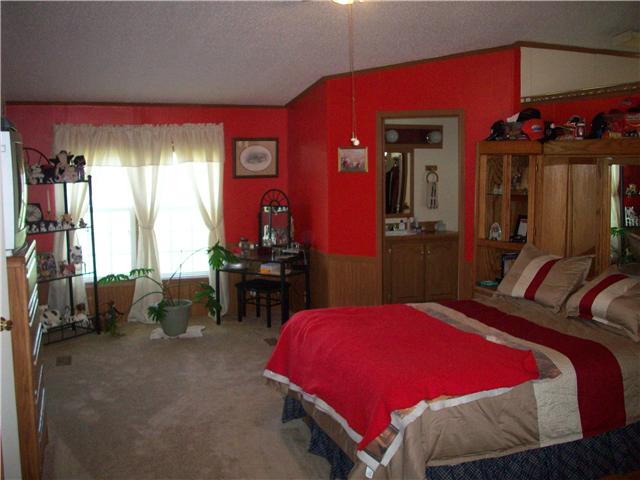 6200 Underwood Road Springfield, TN 37172 - Photo 2 of 16 a bed room with a bed and a chair
