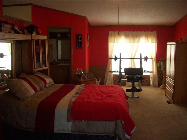 6200 Underwood Road Springfield, TN 37172 - Photo 3 of 16 a bed room with a bed and a chair