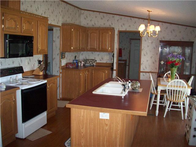 6200 Underwood Road Springfield, TN 37172 - Photo 10 of 16 a kitchen with a table chairs stove and cabinets