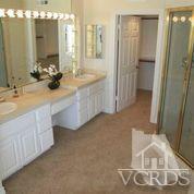 1011 Mandalay Beach Road Oxnard, CA 93035 - Photo 11 of 13 a bathroom with a double vanity sink mirror and double