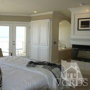 1011 Mandalay Beach Road Oxnard, CA 93035 - Photo 12 of 13 a bedroom with a bed and a view of en suite bathroom