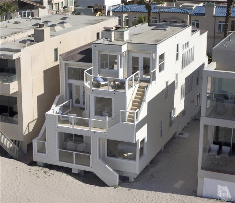 1011 Mandalay Beach Road Oxnard, CA 93035 - Photo 3 of 13 a view of a white building with many windows