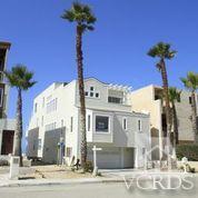 1011 Mandalay Beach Road Oxnard, CA 93035 - Photo 4 of 13 a front view of a building with a garden