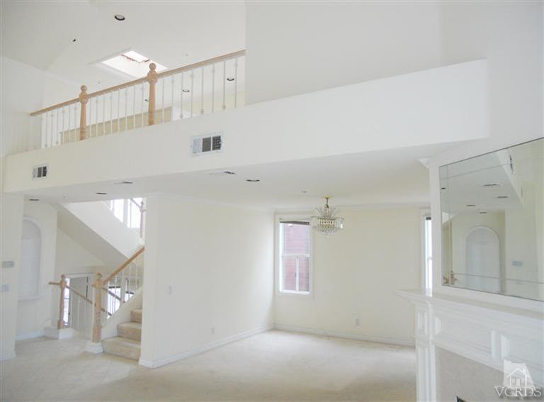 1011 Mandalay Beach Road Oxnard, CA 93035 - Photo 9 of 13 a view of a room with a white ceiling fan and window