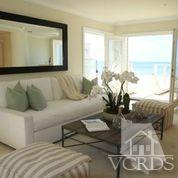 1011 Mandalay Beach Road Oxnard, CA 93035 - Photo 10 of 13 a living room with couches and painted walls with wooden floor