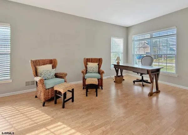 a living room with furniture and a window