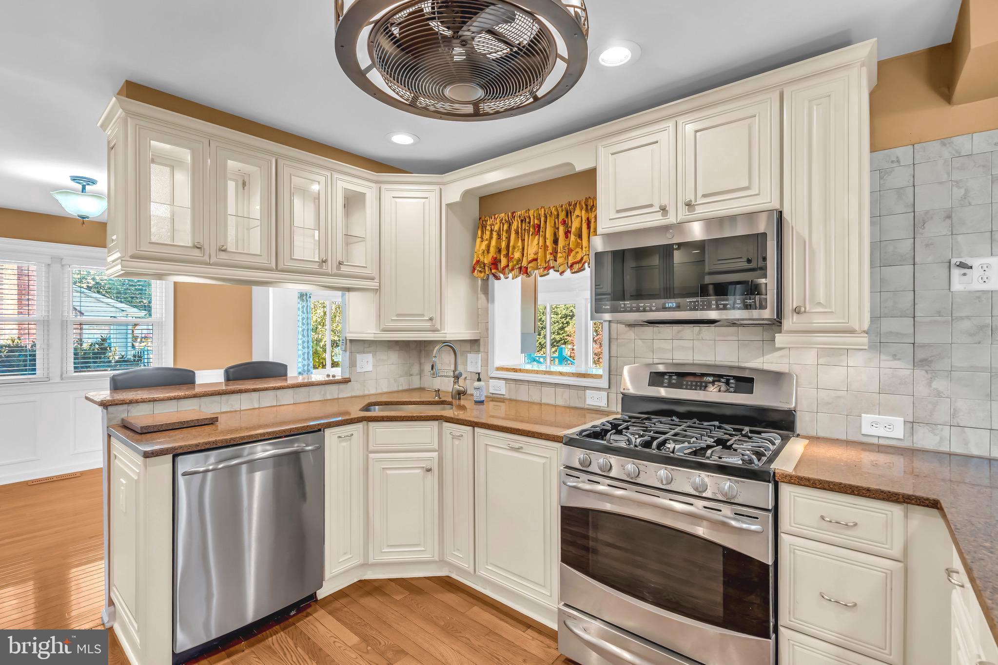721 Rancocas Avenue Riverside, NJ 08075 - Photo 12 of 56 a kitchen with cabinets appliances a sink and a window
