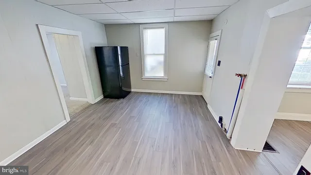 a view of a room with wooden floor and staircase
