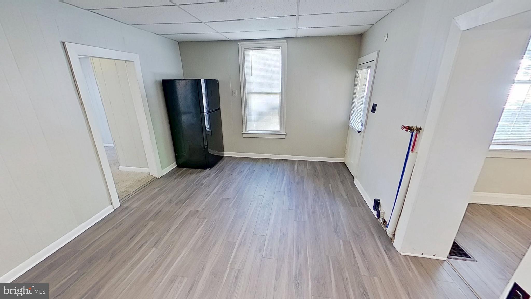 648 Broadway, Unit B Hanover, PA 17331 - Photo 11 of 12 a view of a room with wooden floor and staircase