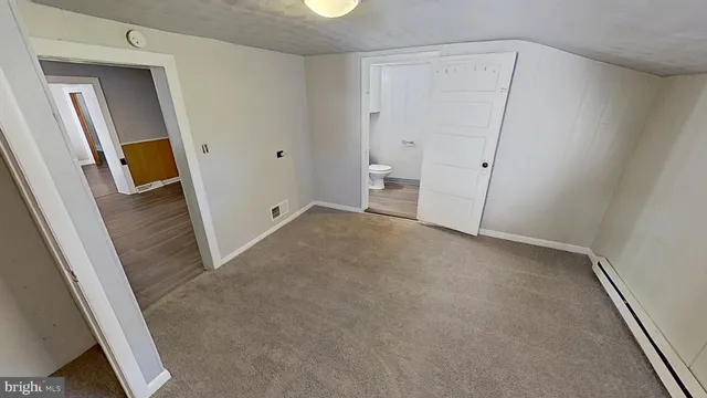 an empty room with mirror