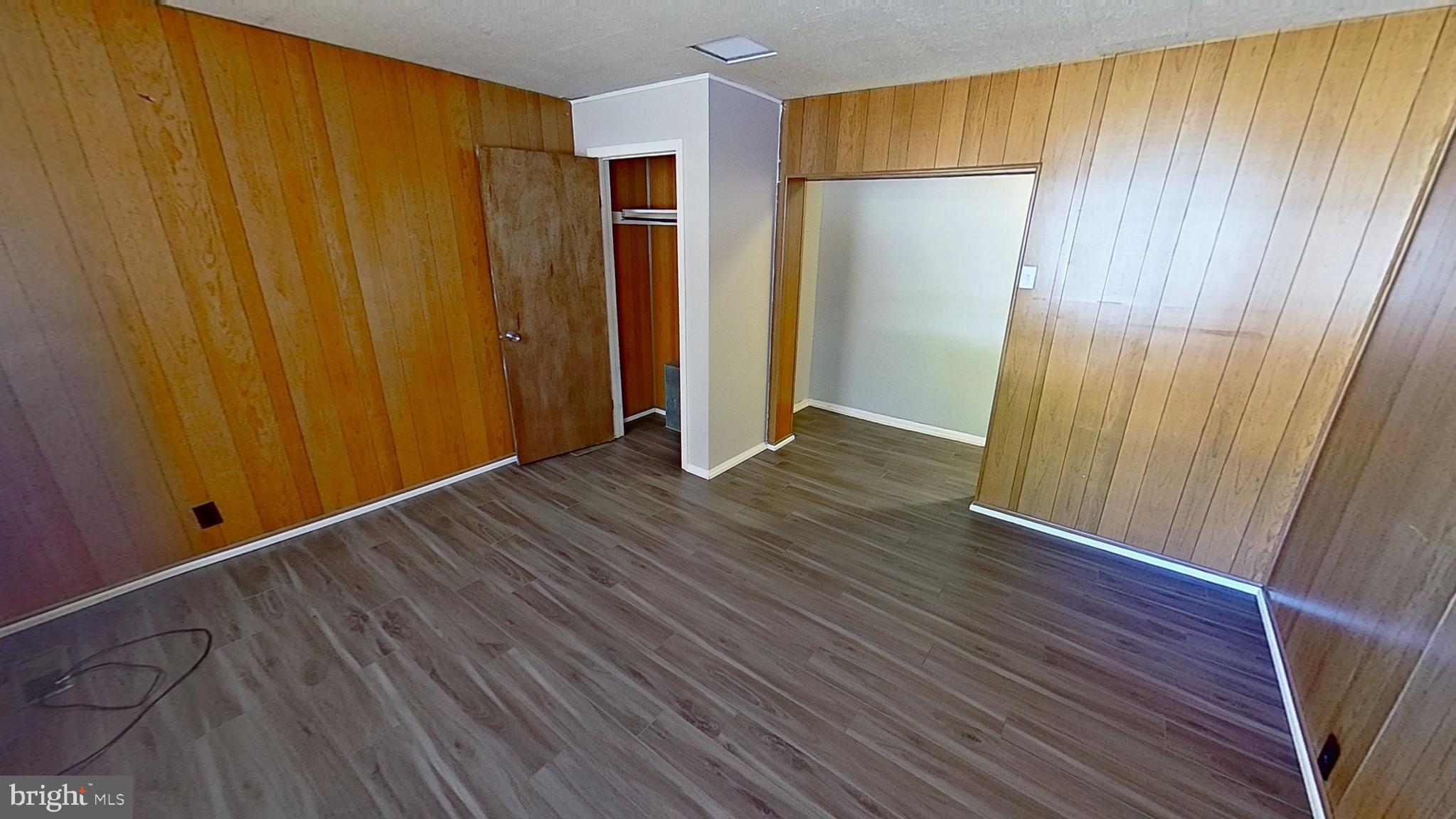 648 Broadway, Unit B Hanover, PA 17331 - Photo 5 of 12 a view of an empty room with wooden door
