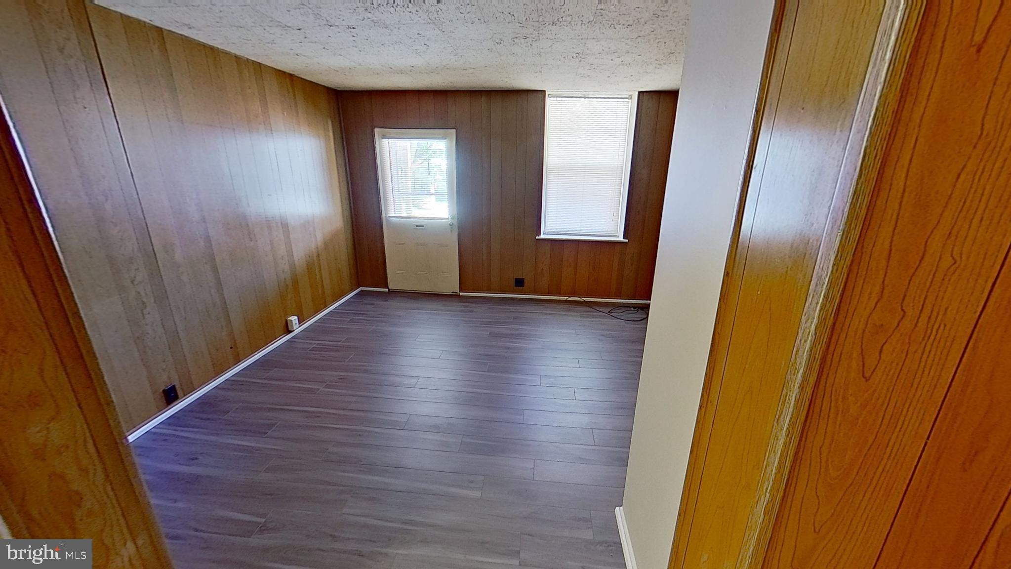 648 Broadway, Unit B Hanover, PA 17331 - Photo 6 of 12 a view of hallway with stairs and wooden floor