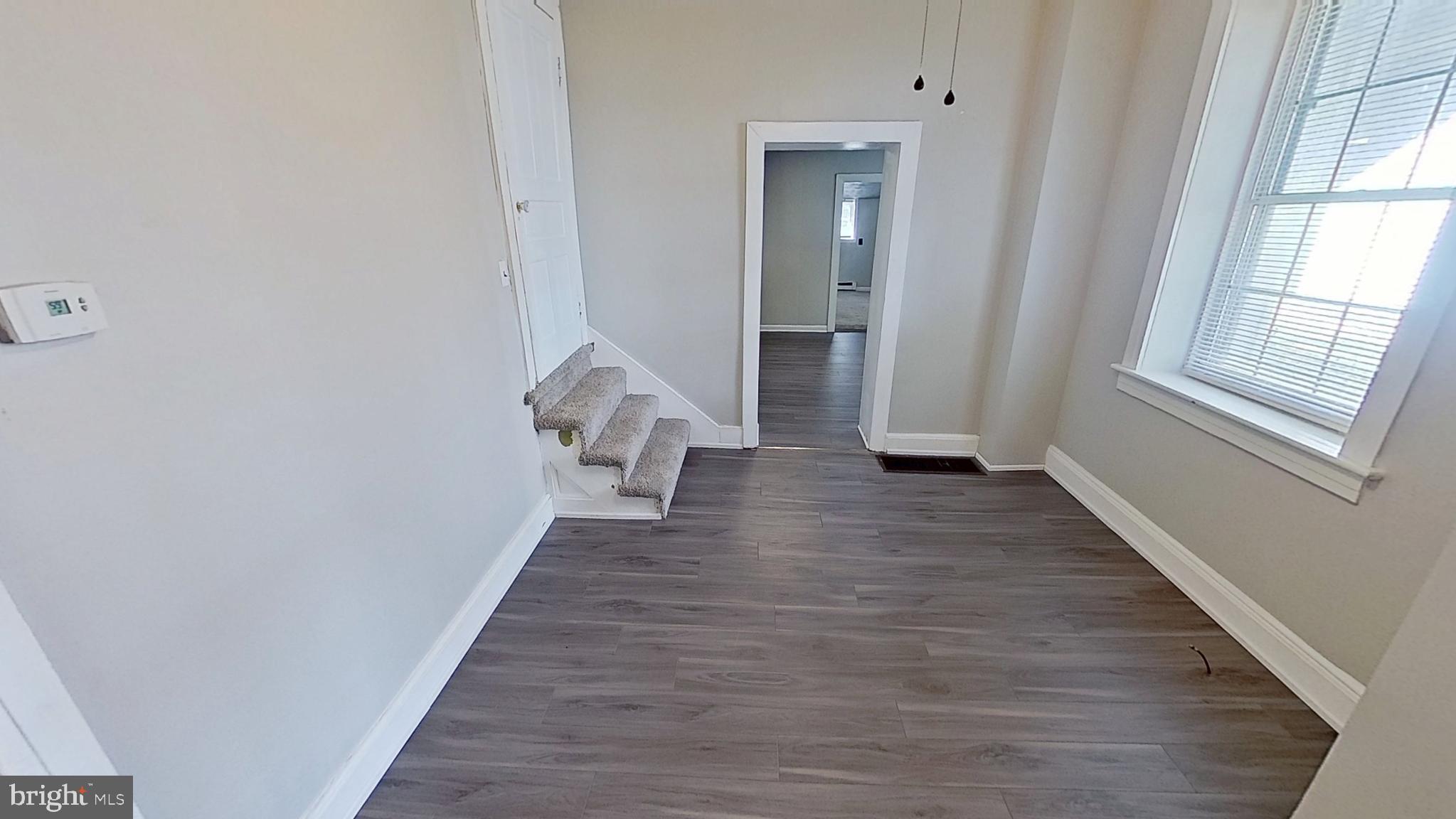 648 Broadway, Unit B Hanover, PA 17331 - Photo 9 of 12 a view of a room with wooden floor and stairs
