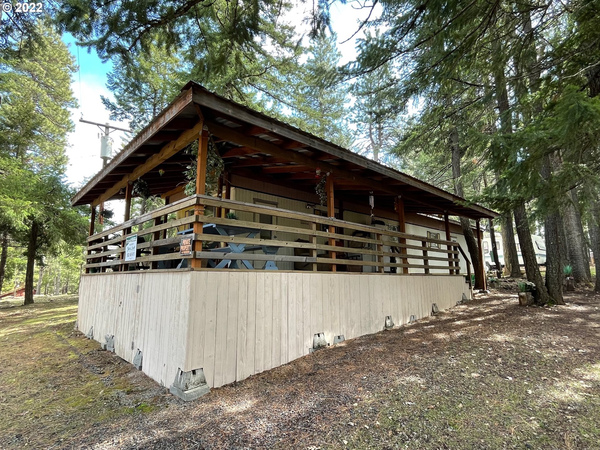 a view of a house with a wooden fence