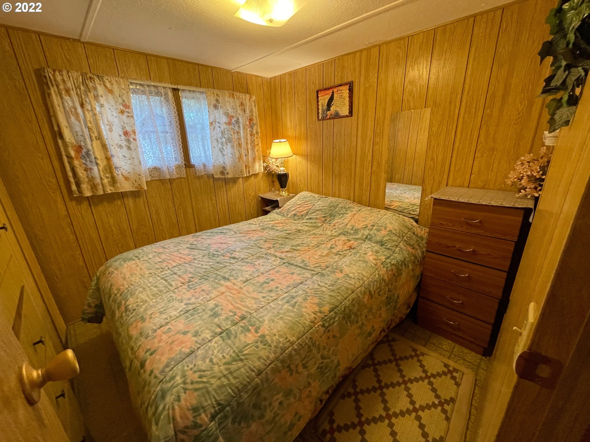 235 Lake View Loop Tygh Valley, OR 97063 - Photo 11 of 24 a bed sitting in a spacious bedroom next to a window
