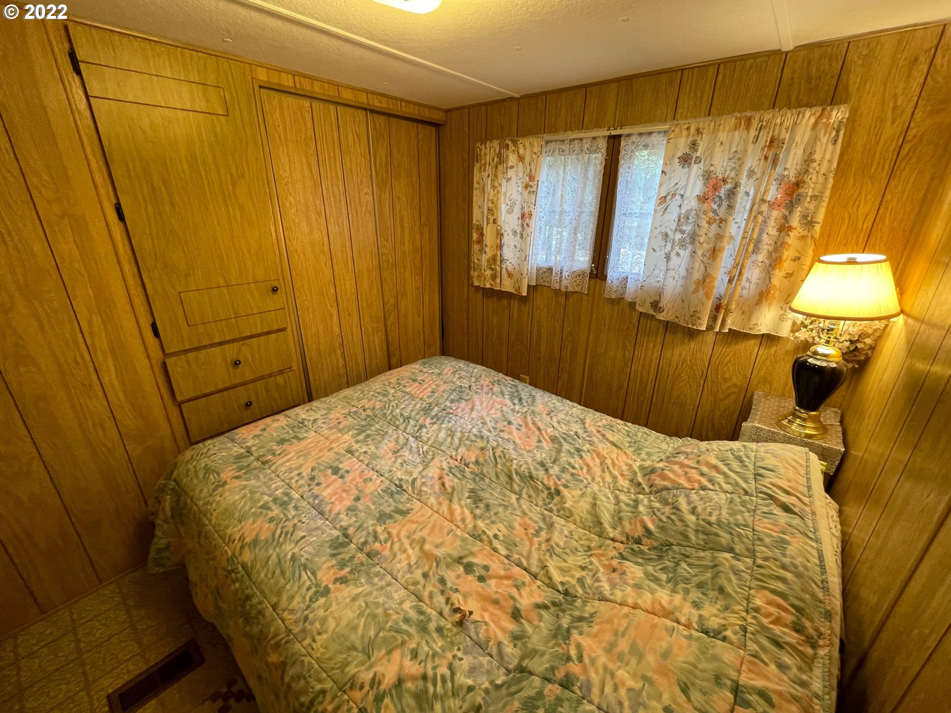 235 Lake View Loop Tygh Valley, OR 97063 - Photo 12 of 24 a bedroom with a bed and a window