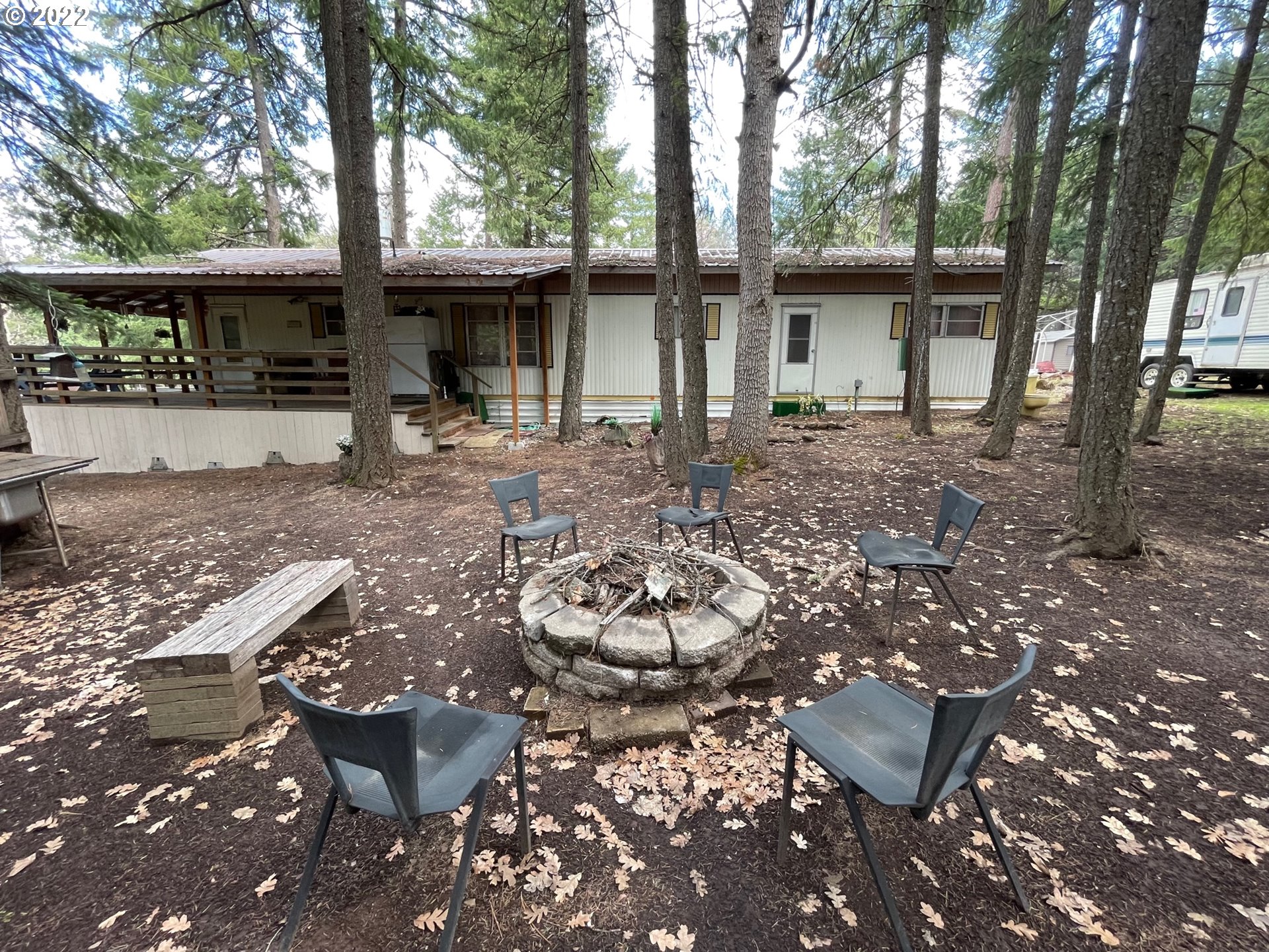 235 Lake View Loop Tygh Valley, OR 97063 - Photo 3 of 24 a view of a chairs and table in backyard